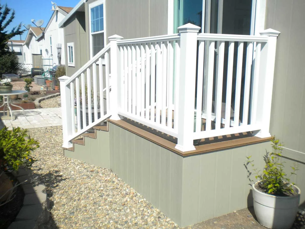 Composite mobile home stairs with white vinyl railing
