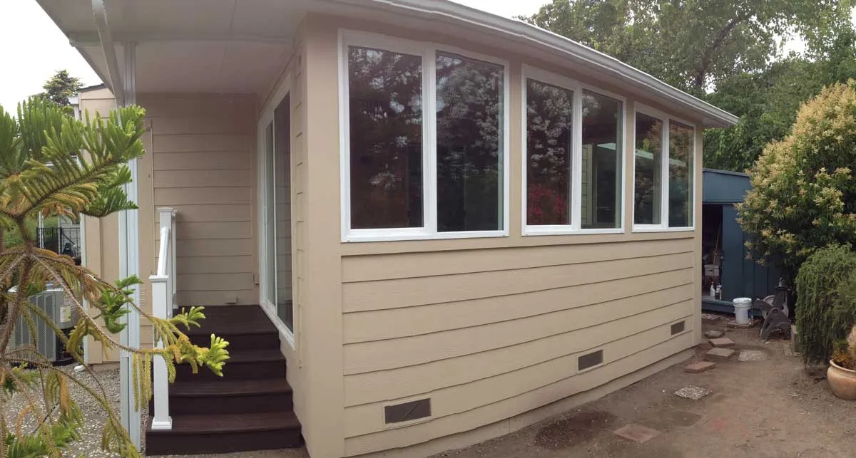 Mobile home sunroom addition with large windows