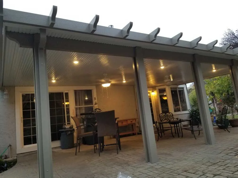 Patio cover with built-in lights and ceiling fans
